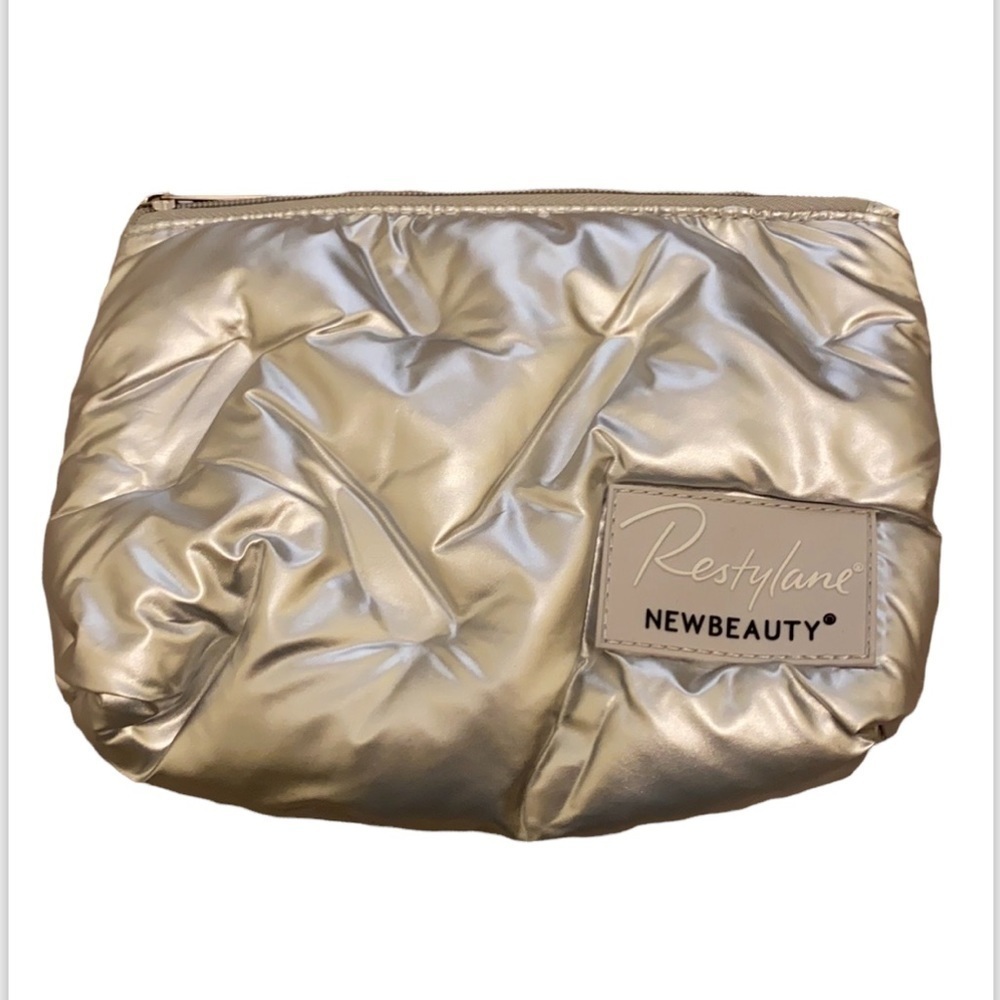 Restylane New Beauty silver cosmetics pouch. New. No tags.